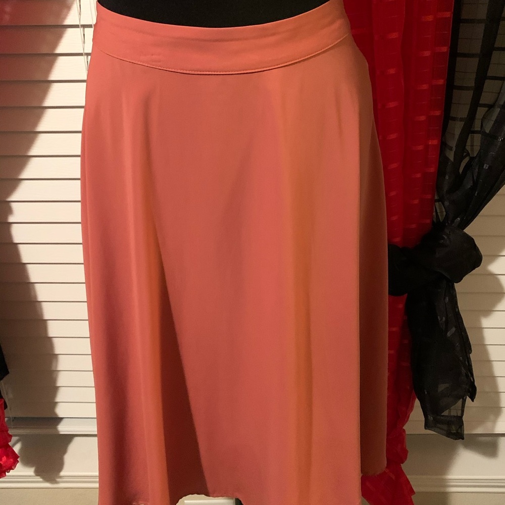 Foley deep coral colored skirt.